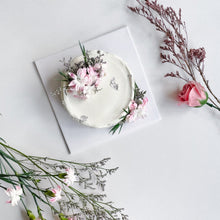 Load image into Gallery viewer, Custom bespoke cake by Kaki Desserts featuring intricate floral decorations and a smooth frosting finish.