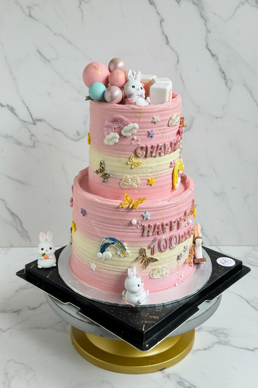 Kaki Desserts 100-days bunny cake with marble frosting, decorated with bunny figure, for special celebration, full view of the cake.