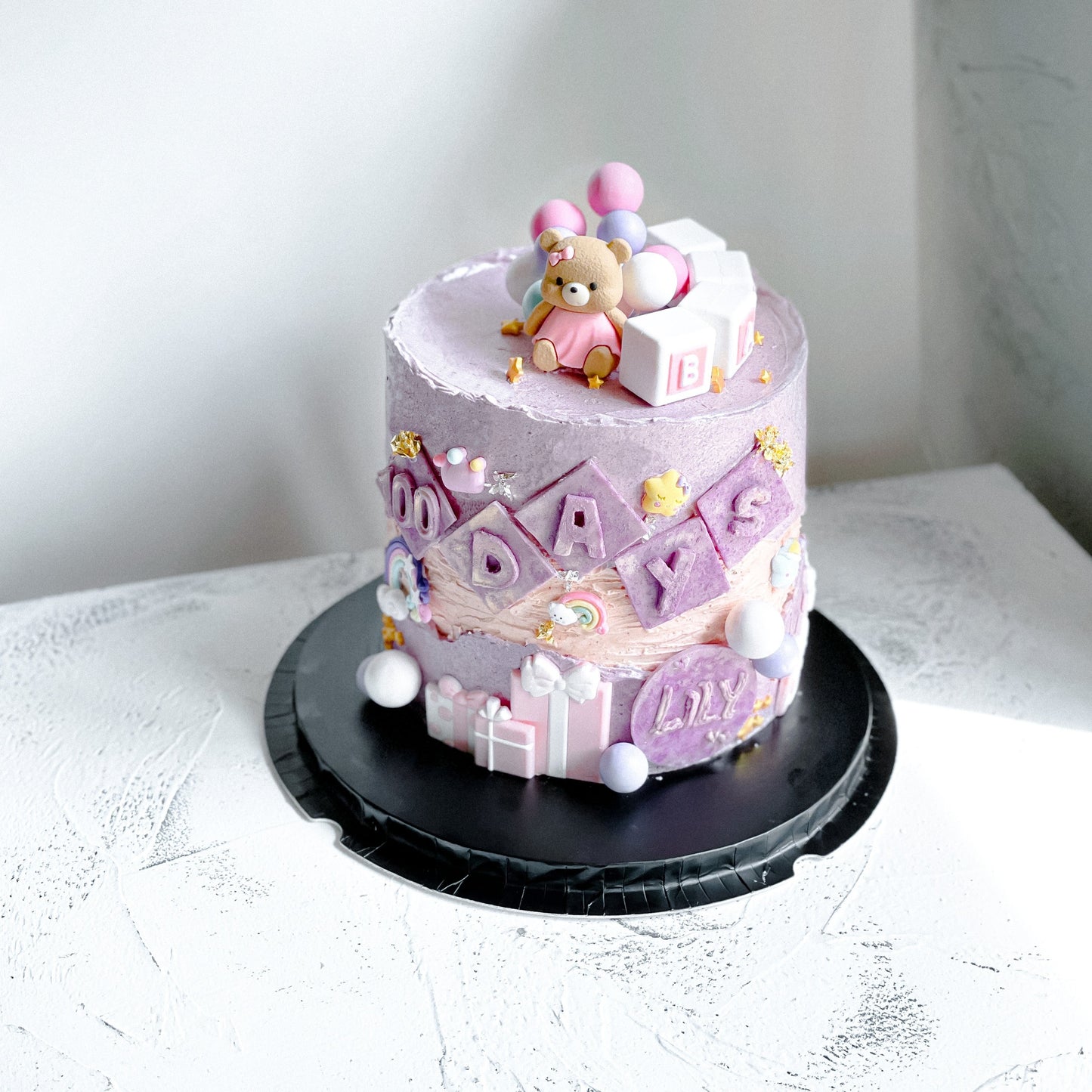 Bespoke 100 Days Ganache Cake by Kaki Desserts with smooth chocolate ganache and elegant decoration on top