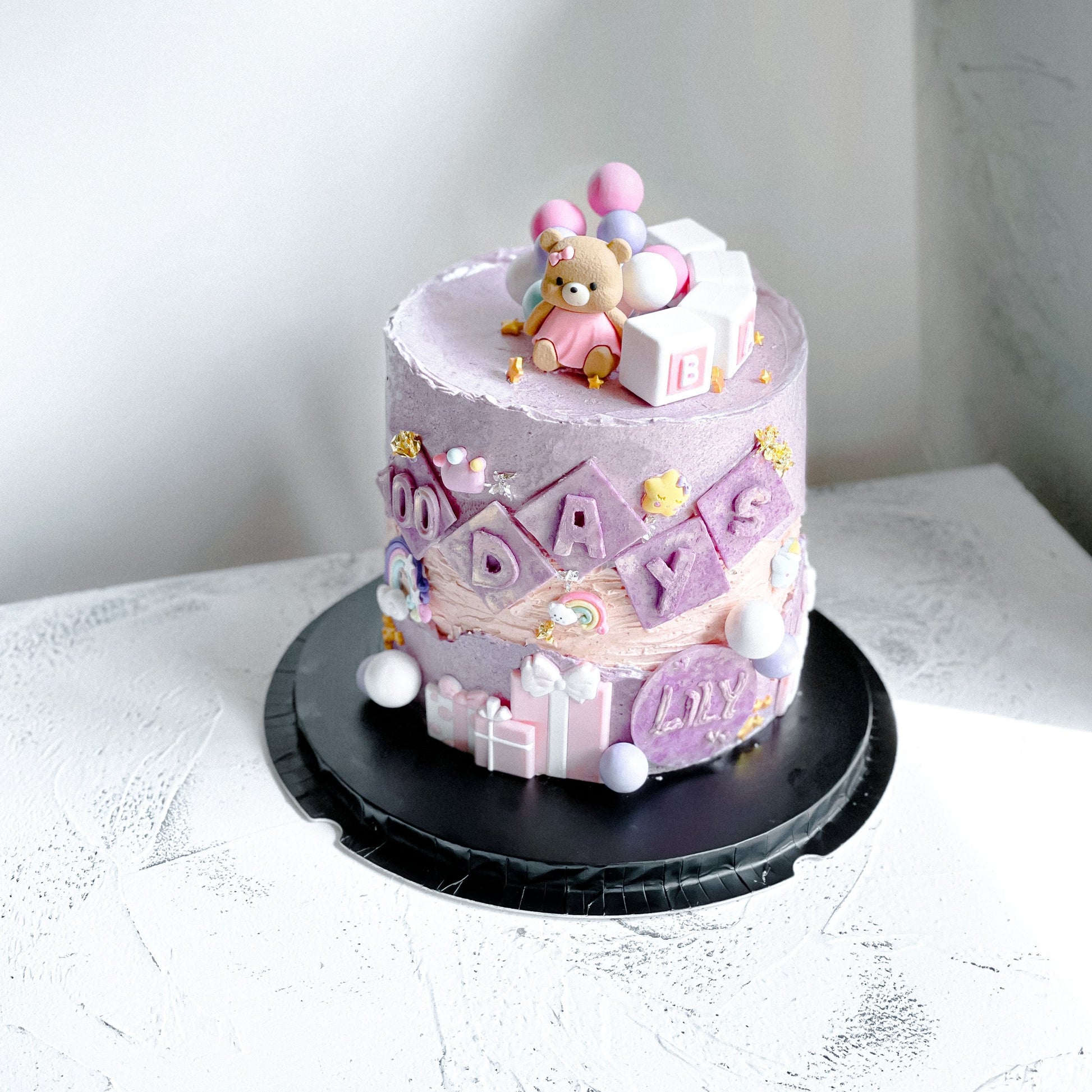 Bespoke 100 Days Ganache Cake by Kaki Desserts with smooth chocolate ganache and elegant decoration on top