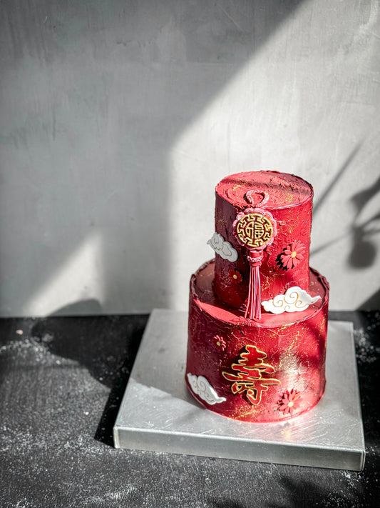 Assorted tier cakes from Kaki Desserts featuring multiple layers and elegant icing, perfect for celebrations.