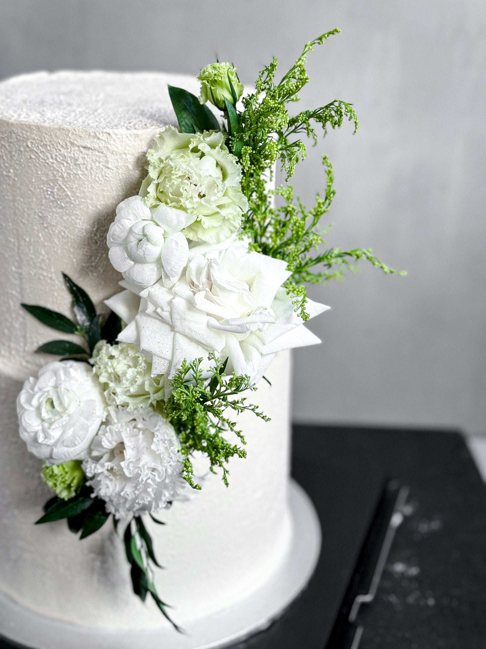 Delicious tier cakes from Kaki Desserts with multiple layered flavors and elegant presentation on a white serving platter.