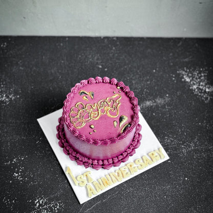 Elegant bespoke cake from Kaki Desserts with intricate floral decorations and smooth frosting, perfect for special occasions.