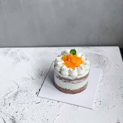 Elegant bespoke cake from Kaki Desserts with intricate floral decorations and smooth fondant finish.