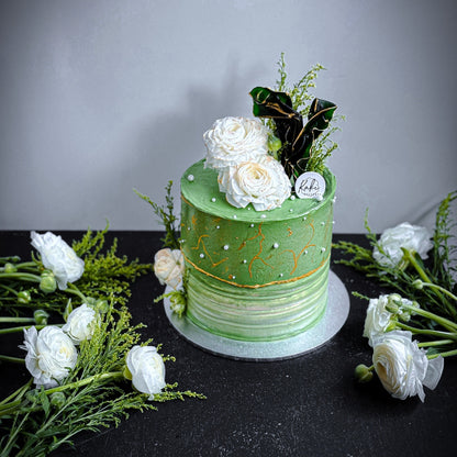 Decorative bespoke cake from Kaki Desserts with intricate frosting and elegant design, perfect for special occasions.