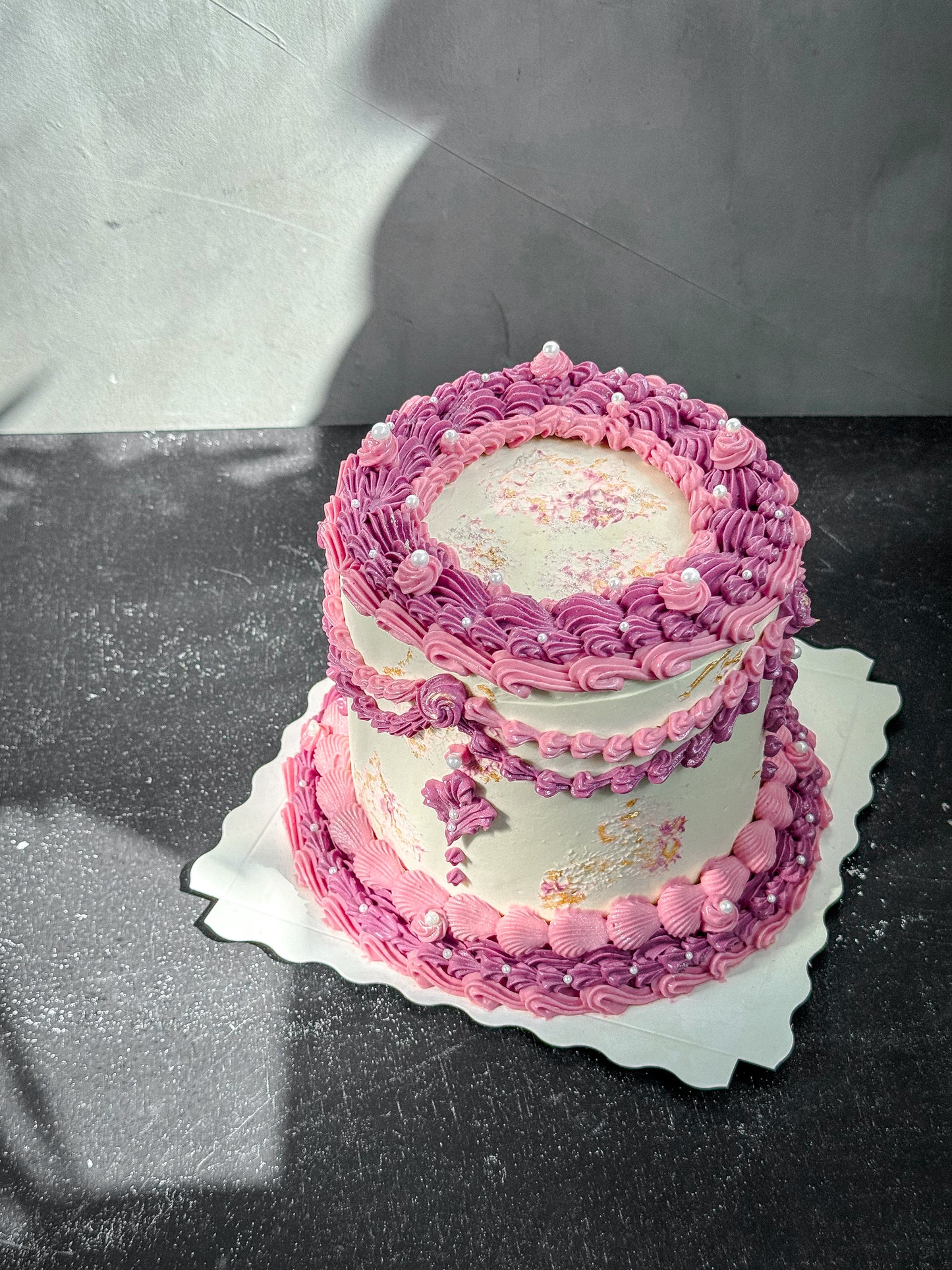 Vintage Kaki Desserts cake with rich frosting and decorative toppings, displayed on a plate ready to serve.