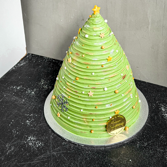 Decorative Christmas tree cake from Kaki Desserts with Gold stars and pearls perfect for the holiday
