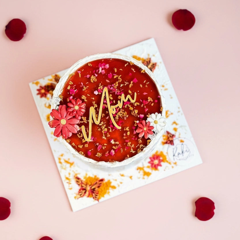 Refined sugar-free honey cake with sour plum flavor from Kaki Desserts, featuring a layered, golden-brown cake topped with sour plums.
