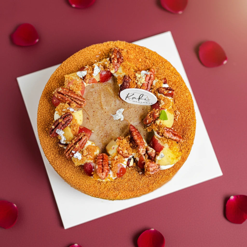 Apple pecan cake from Kaki Desserts, sugar-free, with apple and pecan toppings, decorated for Valentine's Day.