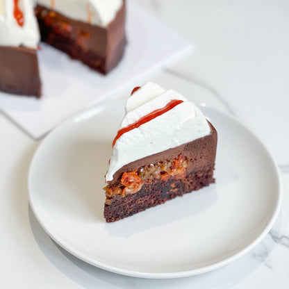 Slice of Goji Chocolate gluten-free cake by Kaki Desserts with rich chocolate layers and goji berry toppings.