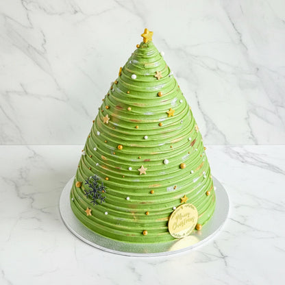 Marble Christmas tree-shaped cake from Kaki Desserts featuring intricate icing and festive holiday design.