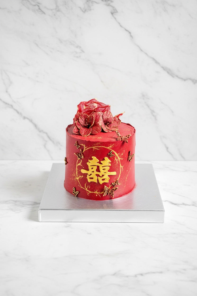 Decorative double happiness cake from Kaki Desserts featuring intricate icing and vibrant floral details, perfect for celebrations.