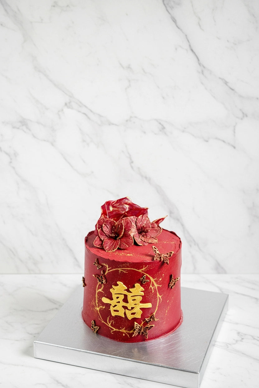 Double happiness cake from Kaki Desserts, a beautifully decorated bespoke cake with intricate designs and vibrant colors.