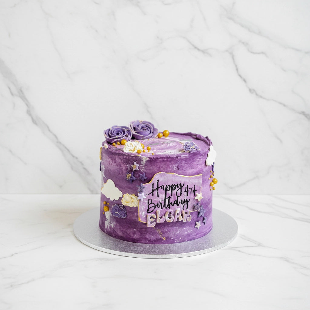 Marble galaxy-themed cake by Kaki Desserts with swirling marble frosting and cosmic galaxy design on top.