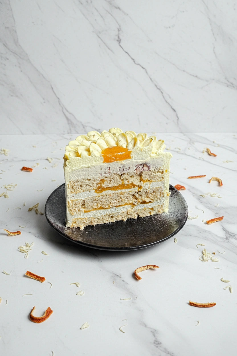 Slice of marble honey cake from Kaki Desserts, showcasing layered, marbled dessert with golden honey glaze.