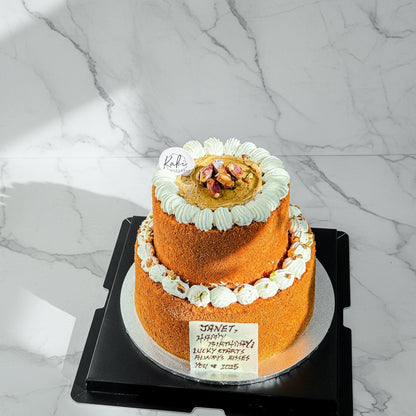 Kaki Desserts pistachio honey cake with marble pattern, sugar-free, showcasing a rich, textured slice with pistachio and honey flavors.