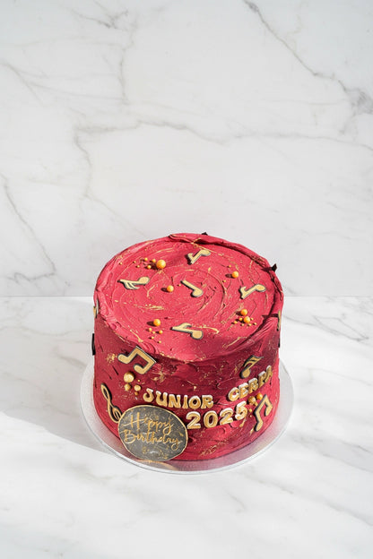 Marble music note cake from Kaki Desserts featuring intricate musical note decorations on a smooth marble cake surface.