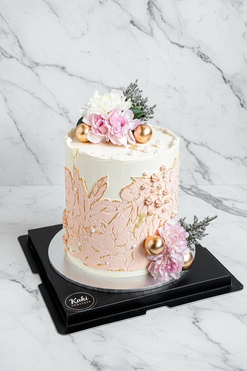 Green marble bespoke cake by Kaki Desserts, featuring intricate marble patterns and elegant design on a white cake stand.