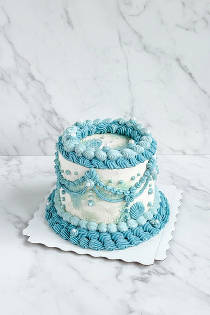 Close-up of a full marble ocean wave-shaped bespoke cake by Kaki Desserts, showcasing intricate marbling and artistic cake design.