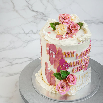 Marble rose-wife cake by Kaki Desserts featuring intricate rose and marble fondant decoration on a white cake.