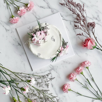 Marble signature honey cake from Kaki Desserts featuring elegant marbled icing and a smooth, polished finish.