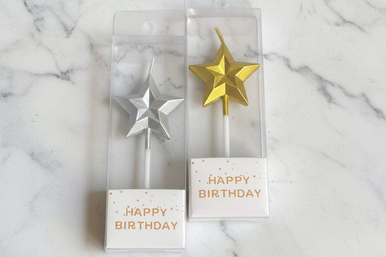Marble star-shaped candles from Kaki Desserts add elegant decor to desserts and celebration tables.