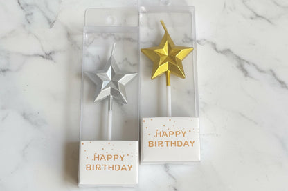Marble star-shaped candles from Kaki Desserts add elegant decor to desserts and celebration tables.