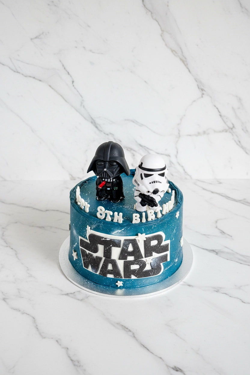 Marble Star Wars-themed cake by Kaki Desserts featuring edible decorations inspired by the popular sci-fi franchise.