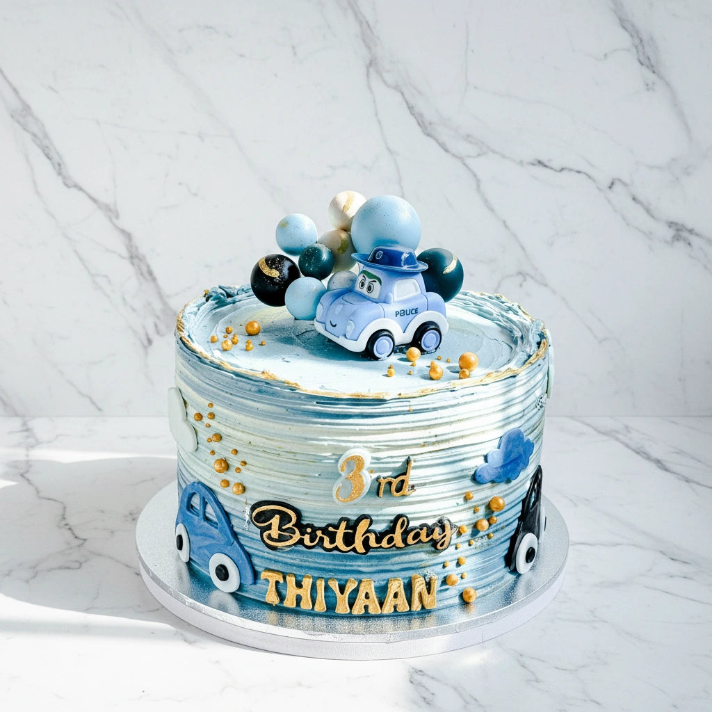 Decorative police car cake by Kaki Desserts featuring a detailed marble design and realistic police vehicle appearance.