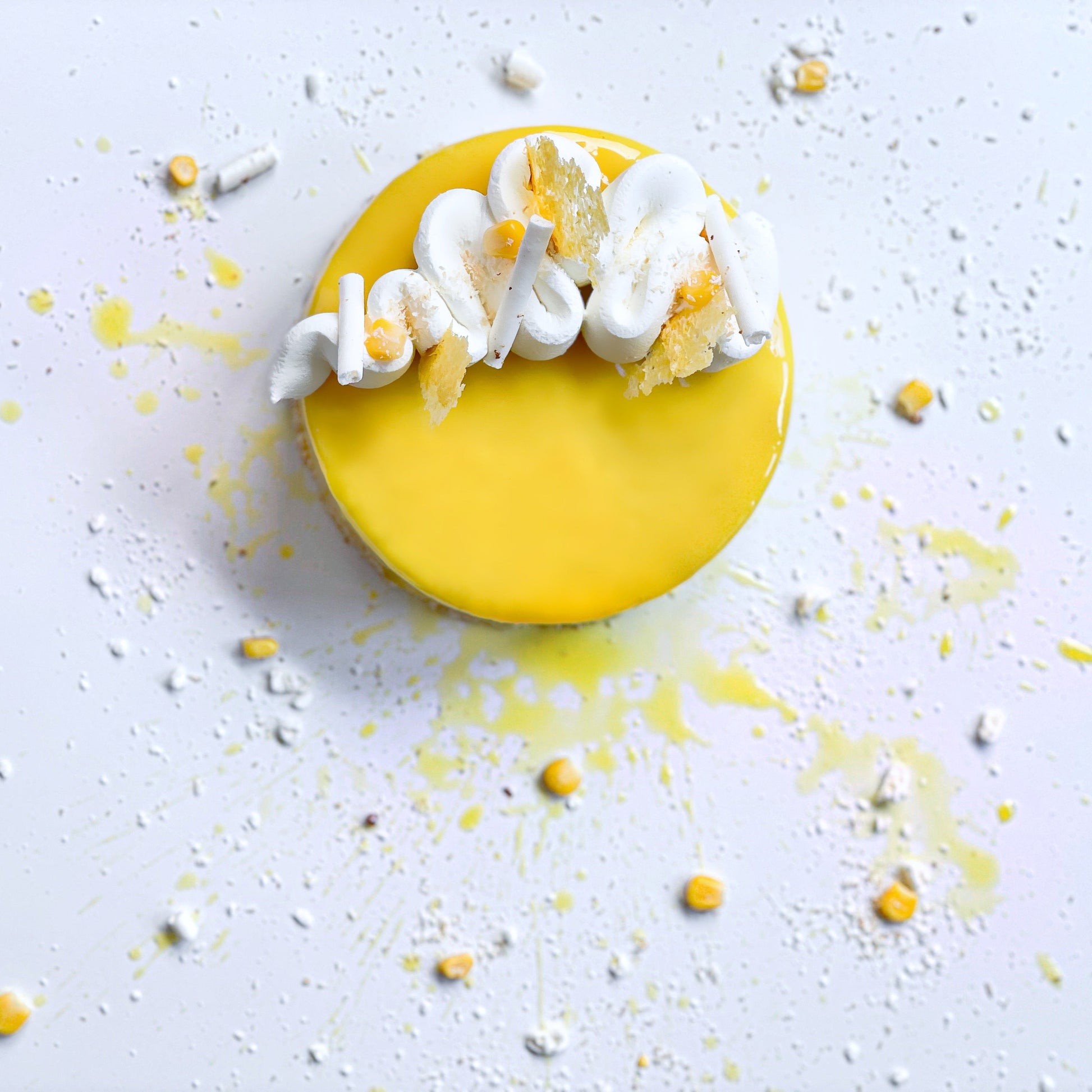 Decorative Maja Blanca cake from Kaki Desserts with smooth white frosting and intricate toppings, showcasing artisanal cake design.