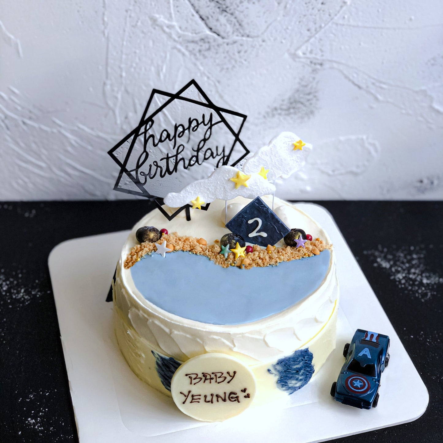 Raspberry and white chocolate cream cake from Kaki Desserts with fresh raspberries and elegant decoration